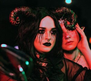 Two guests in horned Halloween makeup at School of Fright, the Halloween party at The Old School Yard in London Bridge, Saturday 31 October